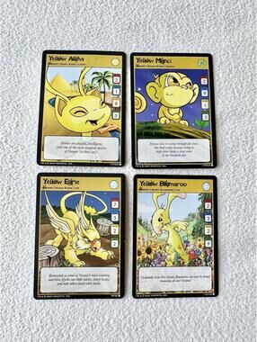 2003 Neopets TCG Yellow Bundle of 4 Trading Cards (Eyrie Mynci Aisha Blumaroo)